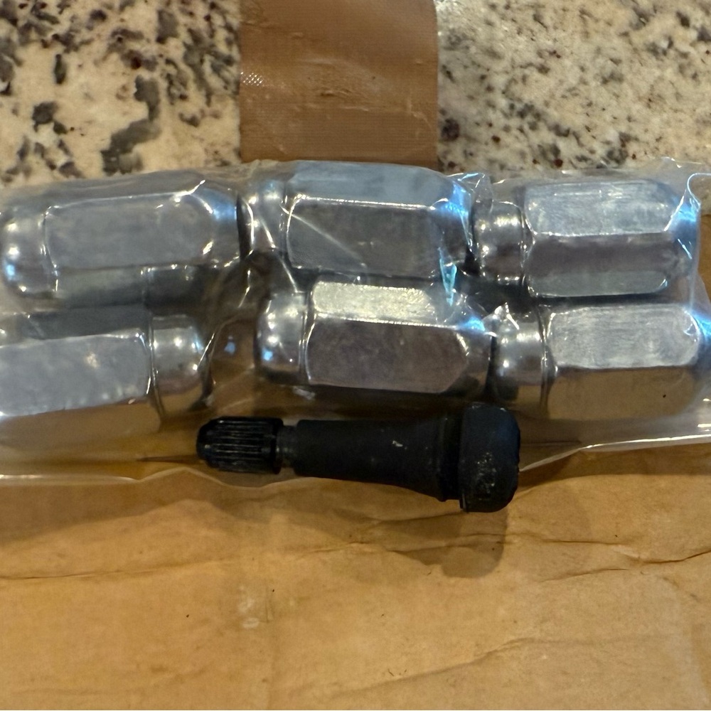 Hexagonal Silver Lug Nuts with Black Valve Stem